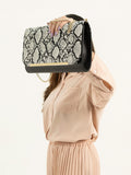 snake-print-clutch