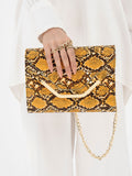 snake-print-clutch