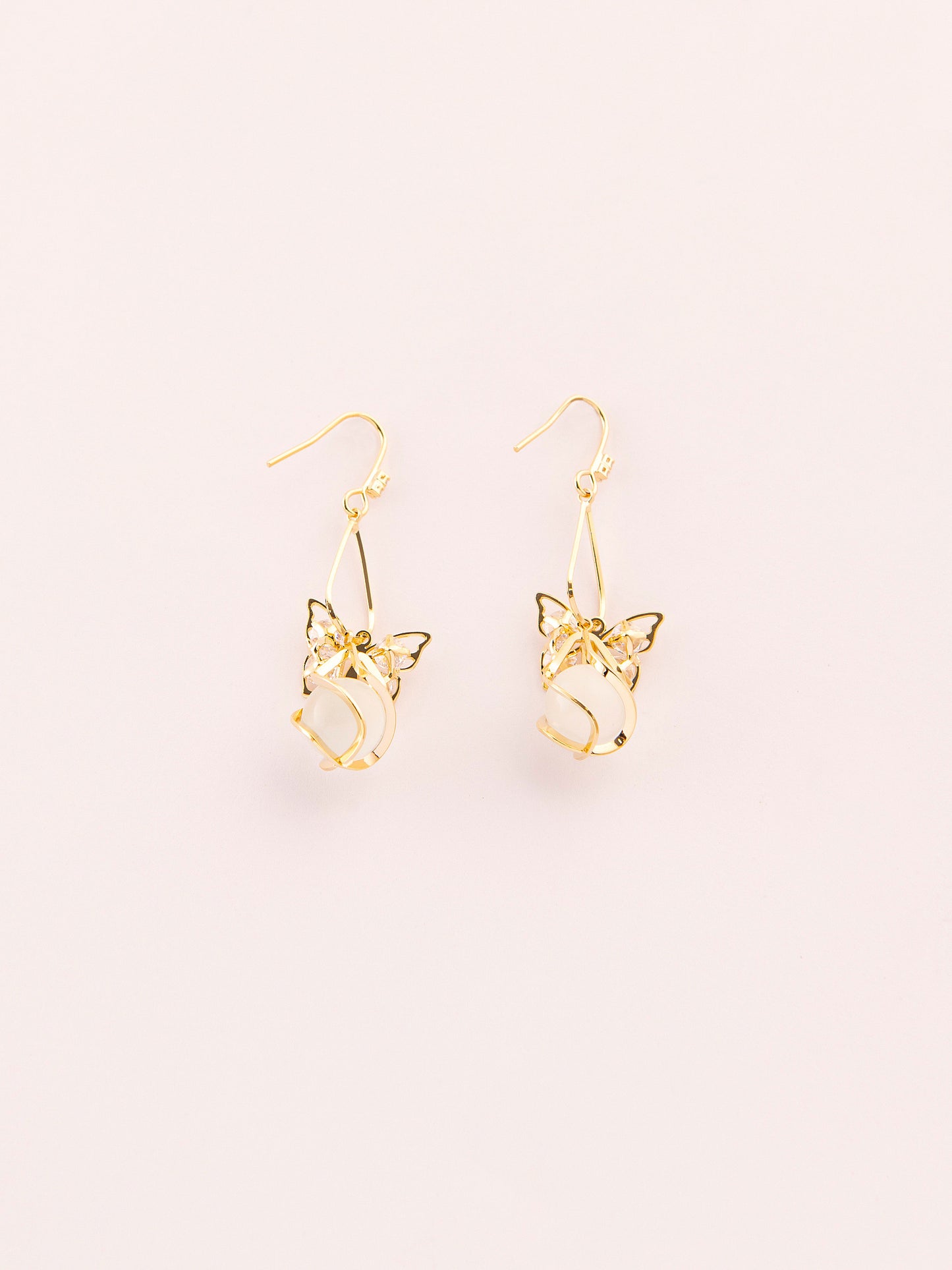 Dangling Caged Pearl Earrings