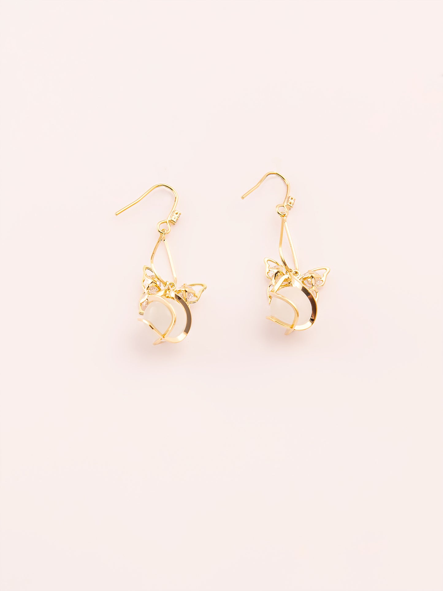 Dangling Caged Pearl Earrings